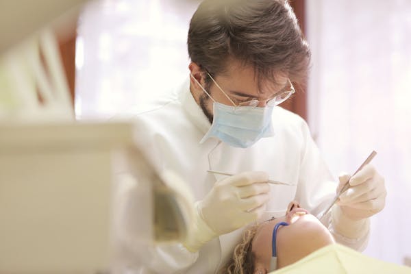 Dentist doing dental work on a patient